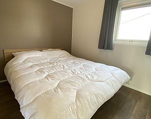 Terrace with parasol at VZ804 Vakantiechalet Arend 1833 Renesse, Schouwen-Duiveland