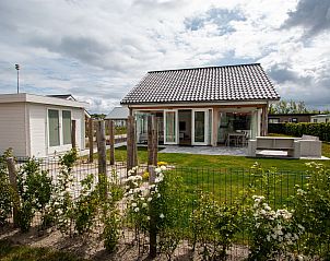 Vacation home Zonnedorp 28 in Renesse with sunny terrace and green garden in Zeeland.