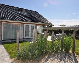 The White Beach House in Renesse with modern architecture and spacious outdoor space.