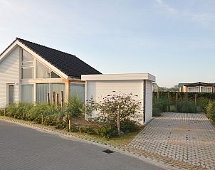 Cozy exterior of Holiday Home Zonnedorp 28 with morning sun in Renesse.