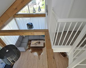 Open interior of The White Beach House overlooking the garden in Renesse.