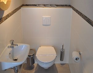 Compact and stylish bathroom in The White Beach House in Renesse, Zeeland.