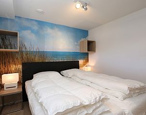 Comfortable bedroom in Holiday home Zonnedorp 28 with beach decor in Renesse.