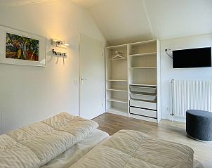 Schlafzimmer mit Aussicht in Ferienhaus Zonnedorp 29 Strandloper, Renesse, Zeeland.