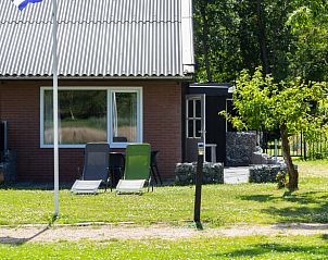 Cottage in Renesse, a charming vacation home in Zeeland with a sunny garden and cozy outdoor area.