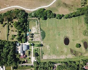 Aerial view of the green surroundings of Huisje in Renesse, a vacation home in Renesse, Zeeland.