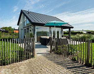 Ferienhaus Zonnedorp 16, 'Bakboord' in Renesse, Zeeland mit sonniger Terrasse und grnem Garten, ideal fr Entspannung und Naturerlebnis.