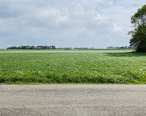 Prachtig uitzicht op velden vanuit VZ182 Vakantiehuis Kerkwerve, Zeeland.