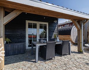 Adembenemende zonsondergang langs de kust bij vakantiehuis ZE1221 in Sint-Annaland, Tholen.