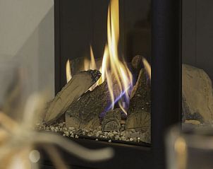 Gezellige open haard in Vakantiehuis Dishoek Dunes Residence, Koudekerke, Walcheren, Zeeland.