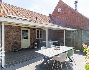 Veranda of vacation home ZE068 in Oostkapelle, Walcheren, Zeeland with cozy sitting area.