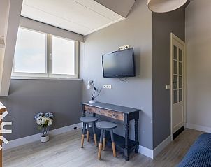 Two comfortable chairs in the garden of vacation home ZE068 in Oostkapelle, Walcheren, Zeeland.