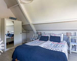Bedroom with a view in vacation home ZE068 in Oostkapelle, Walcheren, Zeeland.