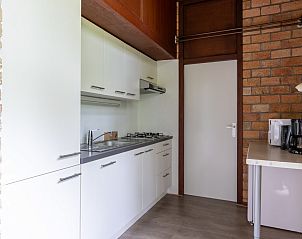 Cozy living room in vacation home ZE366 in Oostkapelle, Walcheren, with fireplace.