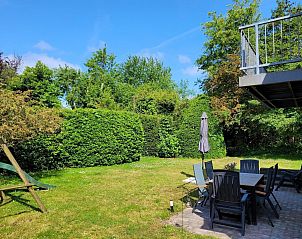 Sunny terrace at VZ2330 Holiday home in Oostkapelle, surrounded by nature, Walcheren, Zeeland.