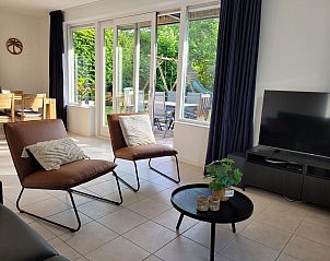 Bright living room overlooking garden in VZ2330 Holiday home Oostkapelle, Walcheren, Zeeland.