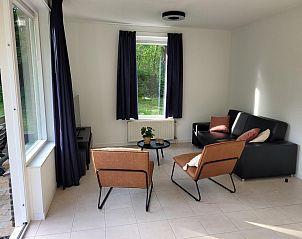 Modern living room with large windows in VZ2330 Holiday home Oostkapelle, Walcheren, Zeeland.
