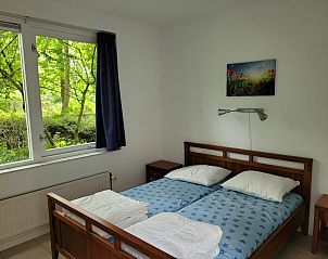 Bedroom with double bed in VZ2330 Holiday home Oostkapelle, Walcheren, Zeeland.