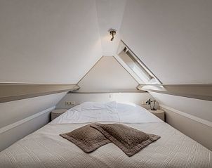 Cozy bedroom under the roof in Holiday cottage in Oostkapelle, Walcheren, Zeeland.