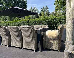 Terrace with dining table at ZE1509 vacation home, Oostkapelle, Zeeland.