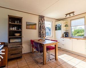 Cozy living room with open kitchen in vacation home ZE414, Oostkapelle, Walcheren, Zeeland.