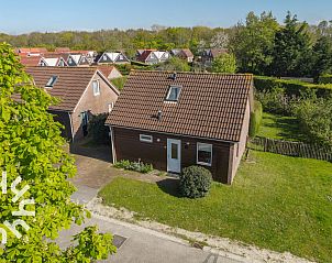 Stylish bedroom with wooden furniture in ZE414, Oostkapelle, Walcheren, Zeeland.