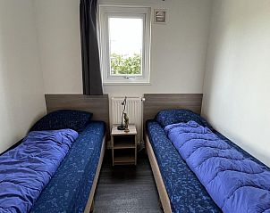 Bedroom with two beds in VZ652 Chalet Oostkapelle, Walcheren.