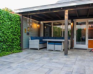 Veranda of vacation home ZE1402 in Oostkapelle, Walcheren, Zeeland with comfortable seating area.