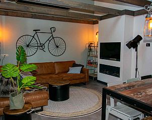 Cozy living room in vacation home ZE1402 in Oostkapelle, Walcheren, Zeeland with modern furnishings.