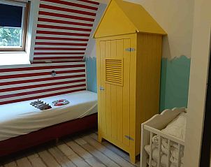 Children's room in vacation home ZE1402 in Oostkapelle, Walcheren, Zeeland with playful decoration.
