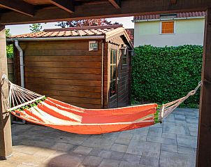 Hammock on the terrace of vacation home ZE1402 in Oostkapelle, Walcheren, Zeeland for relaxation.