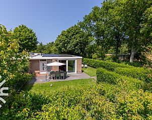 Cozy sitting area in the garden of vacation home ZE145 in Oostkapelle, Walcheren, Zeeland.