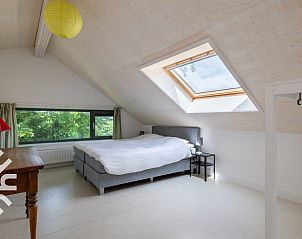 Bright attic room in vacation home ZE263, Westkapelle with sloping skylights.