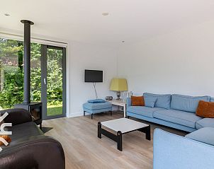 Spacious living room of vacation home ZE263 in Westkapelle with modern furnishings.