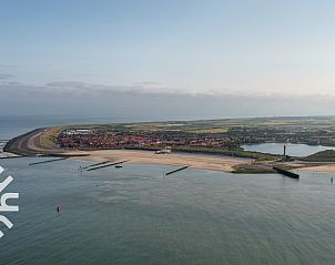Aerial view of vacation home ZE263 in Westkapelle, surrounded by greenery and near the coast.