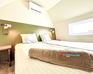 Komfortables Schlafzimmer im Ferienhaus Beach House Westkapelle 103 D, Westkapelle, Walcheren, mit frischer Bettwsche.