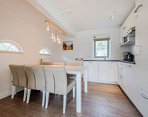 Sfeervolle slaapkamer in bungalow TK5, Domburg, Walcheren. Comfortabel verblijf in Zeeland met moderne inrichting en rustige ambiance.