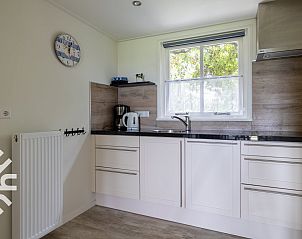 Groene tuin rondom vakantiehuis ZE256 in Aagtekerke, Walcheren, Zeeland.