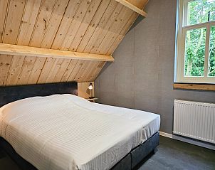 Open keuken en woonkamer in vakantiehuis ZE1484, Aagtekerke, Walcheren, met moderne inrichting en comfort.