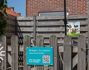 Cozy terrace at vacation home ZE1323 in Zoutelande, Walcheren, perfect for outdoor meals.