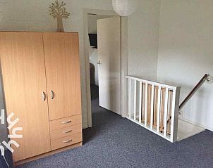 Wooden entrance gate of vacation home ZE1392 in Zoutelande, Walcheren.