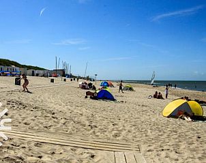 Sunny beach near vacation home ZE583 in Vrouwenpolder, Walcheren, perfect for a day out in Zeeland.