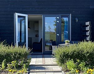 Entrance to VZ583 Studio Vrouwenpolder with terrace and greenery in Walcheren, Zeeland.