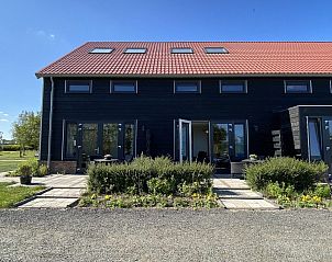 Exterior of VZ583 Studio Vrouwenpolder in Vrouwenpolder with red roof tiles.