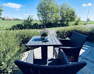 Cozy terrace at VZ583 Studio Vrouwenpolder, surrounded by nature in Zeeland.