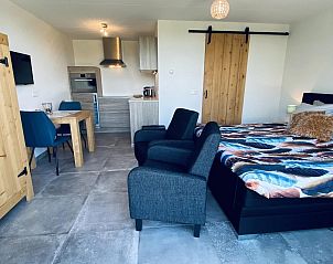 Interior of VZ583 Studio Vrouwenpolder with modern kitchen and sitting area.