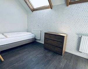 Slaapkamer met eenpersoonsbed in VZ587 Vakantiewoning Vrouwenpolder, Zeeland.