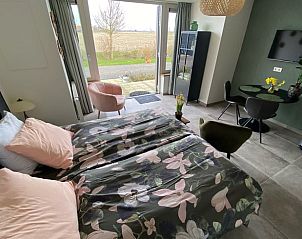 View from the bedroom in Holiday home in Vrouwenpolder, Walcheren, Zeeland with access to terrace.