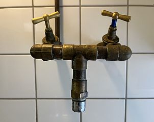 Interior of vacation home ZE120, Veere, Walcheren with open doors to garden.