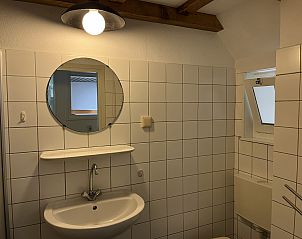 Bedroom decoration in vacation home ZE120, Veere, Walcheren, with flower vase.